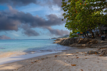 Patong Beach Phuket Thailand nice white sandy beach clear blue and turquoise waters and lovely blue skies with Palms tree sunset sunrise