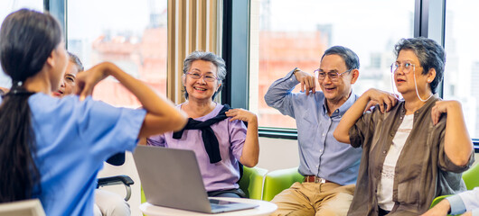 Portrait of asian woman physiotherapist trainer carer help physical and discussing consulting with group asian senior patient by doing yoga workout exercises in rehabilitation at hospital.healthcare