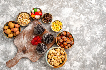 top view delicious chocolate balls cakes with nuts on white background cake biscuit sugar cookies sweet tea