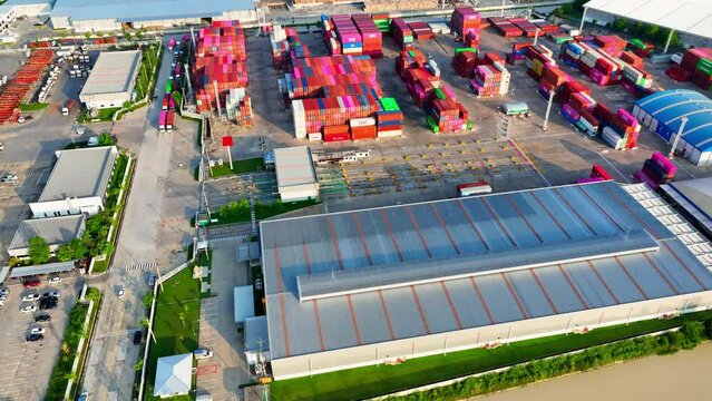 In the logistics industry, container yards play a critical role in the movement of goods from one point to another. They are an essential component of the global supply chain. Aerial view Drone. 4K
