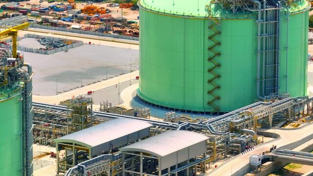 The LNG plant is a large industrial facility that produces liquefied natural gas (LNG) from natural gas sourced from offshore fields. The plant is likely to appear as a sprawling complex of buildings
