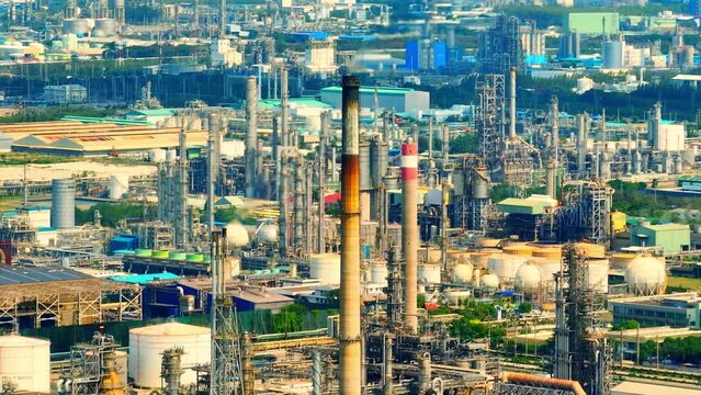Steam emissions of a refinery or petrochemical industry can be observed as plumes of white vapor rising from tall stacks or towers. These emissions are a result of the refining or chemical processing
