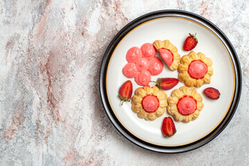 top view delicious sugar cookies with strawberry jelly on a white background jelly fruit cake sugar sweet biscuit