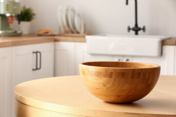 Wooden bowl on table in kitchen