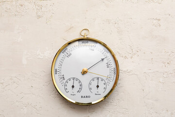 Aneroid barometer on grey grunge background