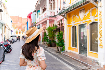 Young woman traveler walking at Phuket old town in Thailand