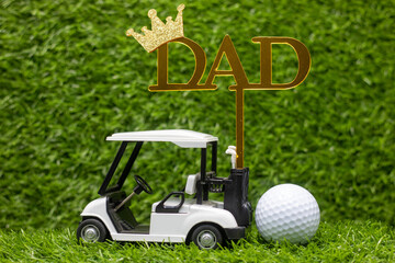 This photo depicts a golf cart with the word 