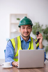 Young male architect working in the office