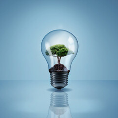Environment, tree in light bulb and save energy, eco friendly and sustainability with renewable resources on blue background. Sustainable development, innovation and electricity with mockup space