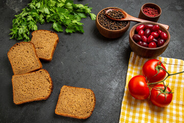top view fresh red dogwoods with dark bread loafs greens and tomatoes on grey background fruit fresh mellow color food