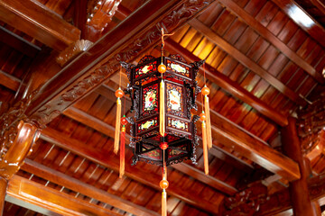 Lanterns hanging from the wooden ceiling