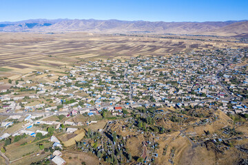 Aerial view of Lchashen village on sunny summer day. Gegharkunik Province, Armenia.