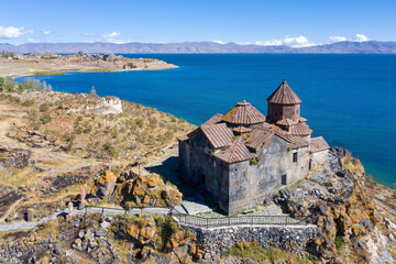 Fototapeta na wymiar Aerial view of Hayravank monastery and Sevan lake on sunny summer day. Gegharkunik Province, Armenia.