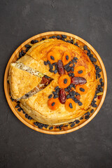 top view shakh plov delicious rice meal cooked inside round dough with raisins on grey background rice cooking dough dinner meal