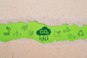 CO2 reducing ,Recycle ,Green factory icon on green torn paper for decrease CO2 , carbon footprint...