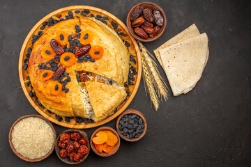 top view shakh plov delicious rice meal cooked inside round dough with raisins on grey floor rice...