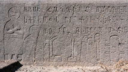 Gravestone on the cemetery of Kotavank church on sunny summer day. Nerkin Getashen, Gegharkunik Province, Armenia.
