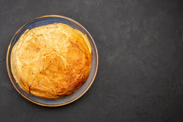 top view tasty shakh plov cooked rice inside round dough on the grey background rice dinner meal cooking dough food