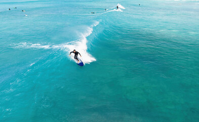 Surfer riding a wave in Hawaii