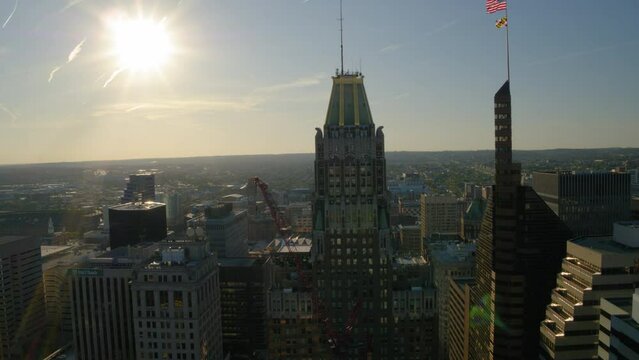 Aerial Shot Of Towers In City Against Sky With Horizon In Background On Sunny Day - Baltimore, Maryland