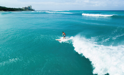 Hawaiian surfer riding a wave