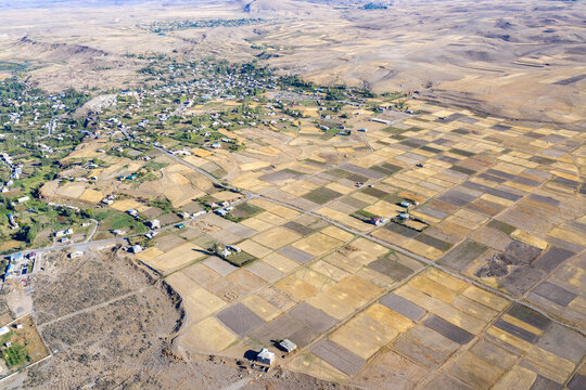 Armenian rural landscape. Aerial view of Karchaghbyur village on sunny summer day. Gegharkunik Province, Armenia.