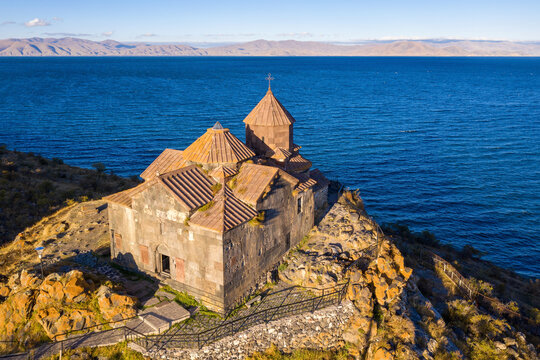 Aerial view of Hayravank monastery and Sevan lake on sunny summer evening. Gegharkunik Province, Armenia.