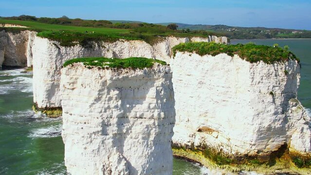 Telephoto aerial shot of limestone stacks on Dorset's Jurassic coastline called Old Harry Rocks, UK	