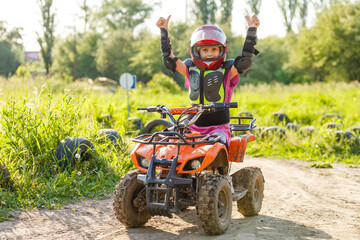 Girl riding an electric quad bike © Angelov