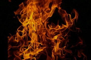 Bright flame of fire burning in the dark