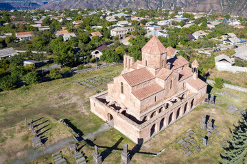 Aerial view of Odzun Church on sunny summer day. Odzun village, Lori Province, Armenia.