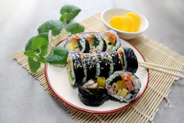 Korean roll Gimbap(kimbob) made from steamed white rice (bap) and various other ingredients