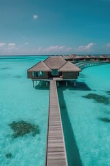 Fototapeta na wymiar Amazing drone view of the beach and water with beautiful colors. Paradise scenery water villas with amazing sea and beach, tropical nature. summer vacation.
