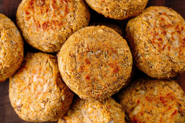 Portion of fresh vegetarian falafels on wooden board