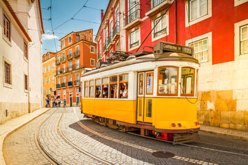 Plakat tram on narrow street of Alfama, Lisbon