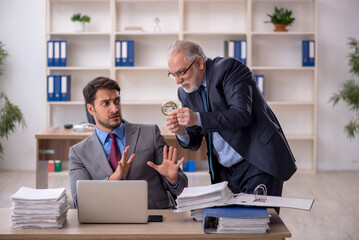 Two male colleagues working in the office