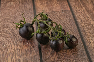 Ripe tasty black cherry tomato