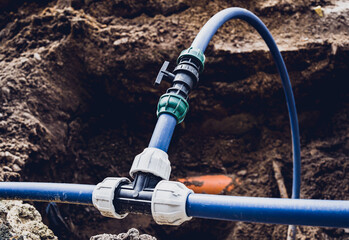 Big construction site with pipes and wires in the construction area.
