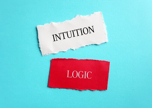 White and red ripped paper with text LOGIC and INTUITION , concept of choosing using logic to make decision or follow instinct - trusting feelings of intuition which valuable in some circumstances