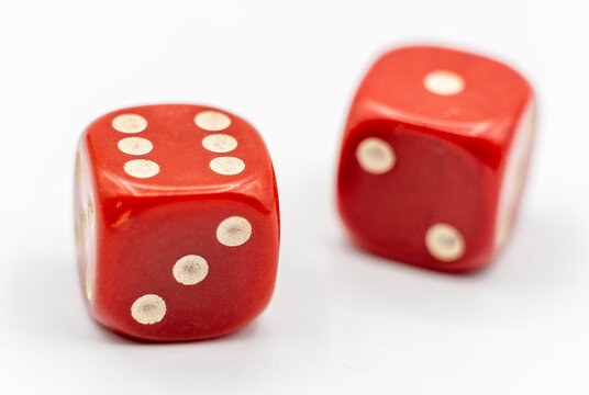 Two Dice Rolling On Table Stock Photo