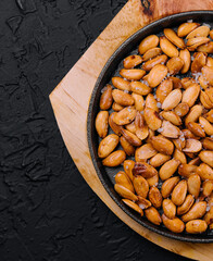 Organic roasted salty peanuts in a pan