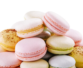 Multicolored macaroons on ceramic plate isolated on white
