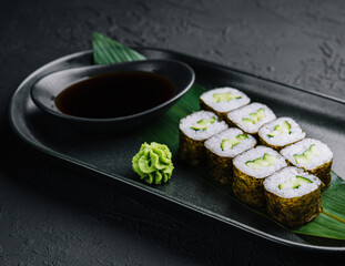 Kappamaki - cucumber sushi roll on black plate