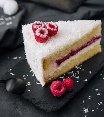 Winter cake with white cream decorated raspberries