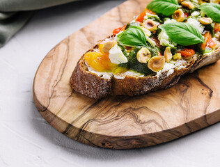 bruschetta with pesto, hazelnuts, cheese and basil
