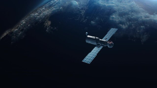 Artificial Earth satellite orbiting the planet flies away in the space of space. concept video Technology and Space