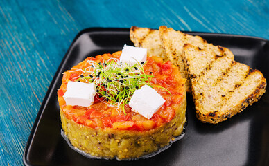 Quinoa salad with tomato and avocado tartare and eggplant