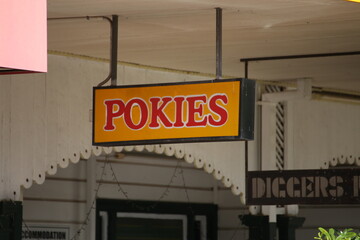 old pokies sign at a pub
