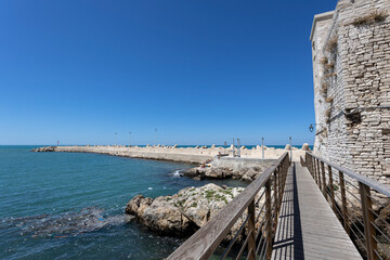 Fototapeta na wymiar View of the pier of the fishing village of Giovinazzo, province of Bari, Puglia, Italy