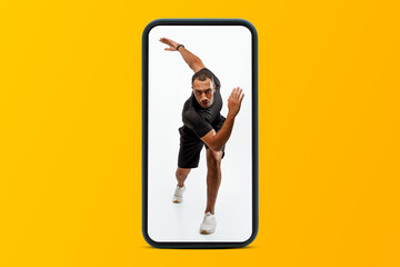 Professional young black man in sportswear running on phone screen